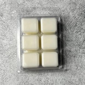 6 wax melt cubes that are natural in color displayed on its back side