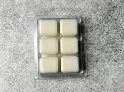 6 wax melt cubes that are natural in color displayed on its back side